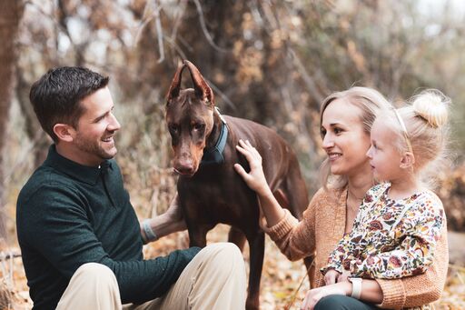 photo of Leah, her fiance, daughter and dog